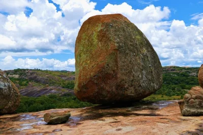 Walk among matobo’s balancing rocks, track white rhinos with a local guide, and see ancient san cave art. includes pickup, lunch, and expert insights.
