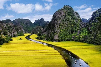 Ride a bamboo boat through tam coc, cycle rural lanes, and hike mua cave with a local guide. includes pickup, lunch, and all logistics from hanoi.