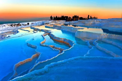 Explore pamukkale’s travertines and hierapolis hot springs on a guided day trip from kusadasi. includes lunch, hotel pickup, and expert local guide.