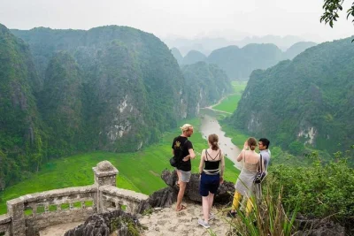 Experience ninh binh’s ancient capital, boat ride in tam coc, biking, and mua cave hike with a local guide. includes pickup and lunch. book now.