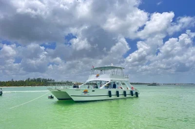 Experience a punta cana sunset catamaran cruise with snorkeling, live dj, and open bar. swim at bavaro beach and enjoy music, drinks, and tropical vibes.