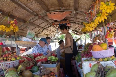 Descubra cai be no delta do mekong com guia local—passeio de barco, aula de culinária, caiaque e degustação de frutas frescas. inclui traslado do hotel.