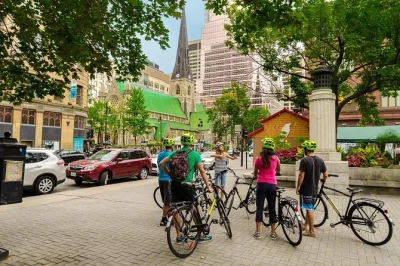Pedal through montreal’s riverside, explore iconic architecture, ride the f1 track, and unwind with local beer or wine. includes guide, e-bike option, and drinks.