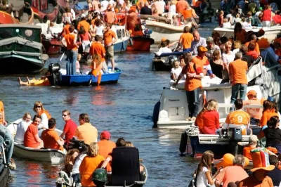 Celebrate kingsday in amsterdam from the canals with unlimited drinks, lively music, and a local crew. book now for a front-row party view.