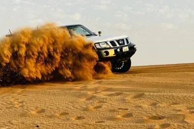 Experience dune bashing, a camel ride, and a bbq dinner in dubai’s desert with a local guide. includes hotel pickup and return. book your spot now.