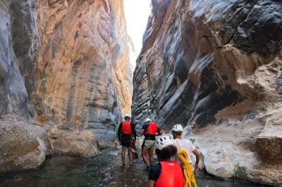 Experience oman’s snake canyon with a local guide—hike, swim, and abseil through wild landscapes. includes pickup, safety gear, snacks, and omani lunch.