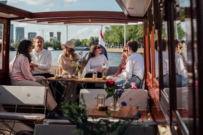 Sip cocktails as you drift past amsterdam’s old church, red light district, and skinny bridge on a luxury canal cruise with live guide and blankets included.