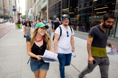 Walk through midtown nyc with a local guide, grab $1.50 pizza, take photos at times square & rockefeller center, and end at a classic neighborhood bar.