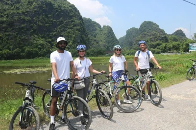 Ride from hanoi’s old quarter to red river island and train street with a local guide. includes bike, pickup, and egg coffee. book your spot now.