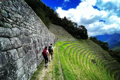 Walk the short inca trail from cusco to machu picchu with a local guide. includes hotel pickup, train, permits, and dinner in aguas calientes.