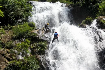 Full-day adventure from medellín: rappel a 30m waterfall in san luis, swim in antioquia’s largest natural pool, with guide and private transport.